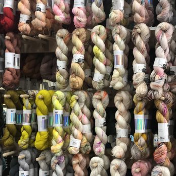 McKinney Knittery - Hedgehog Fibres yarn IN STOCK!!!!  I need a wall of yarn like this one. - Embroidery & Crochet Near Me - McKinney, Texas