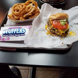 a burger and onion rings a burger and onion rings