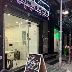 Que Rico - Exterior. Entrance