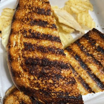 The Coffee Grinder - a grilled sandwich and potato chips - Coffee & Tea Near Me - Tustin, California
