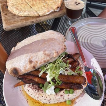 Avec - Chicago - Hummus with roasted baby carrots, smoked almond harissa, spring peas, feta and a hearth baked pita, the deluxe focaccia & espresso martini - Mediterranean Near Me - Chicago, Illinois