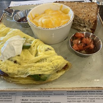 First Watch - (Bacado) Bacon and Avocado omelet with a side of Bread and Cheese Grits! - Breakfast & Brunch Near Me - Glen Burnie, Maryland