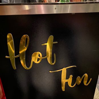 Hot Tin - The front podium stand at the entrance of the hotel - Cocktail Bars Near Me - New Orleans, Louisiana