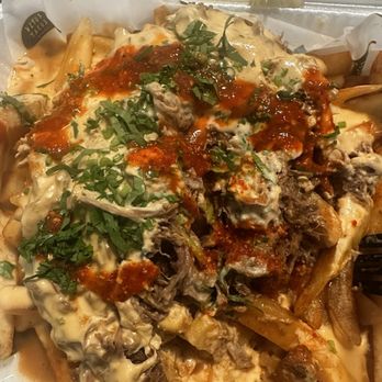 Vitos Tacos - Added cilantro and some red salsa on truffle birria fries - Tacos Near Me - Las Vegas, Nevada