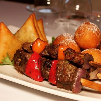 Okapi Bistro - Appetizer platter: Samosas, Beignets & Beef Kabobs - African Near Me - Bloomingdale, Illinois Okapi Bistro - Appetizer platter: Samosas, Beignets & Beef Kabobs - African Near Me - Bloomingdale, Illinois