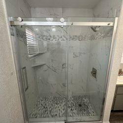 Vision Builders - Removed old tub and tiled walls, turned this into a walk in shower. Simple and clean, yet elegant.