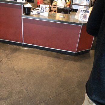 Wingstop - Look at the food on the right on the counter. The girl with the bonnet looks like she is actually doing her job professionally. - Chicken Wings Near Me - Newnan, Georgia