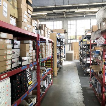 GreenTree Maintenance - a large warehouse with lots of boxes - General Contractors Near Me GreenTree Maintenance - a large warehouse with lots of boxes - General Contractors Near Me