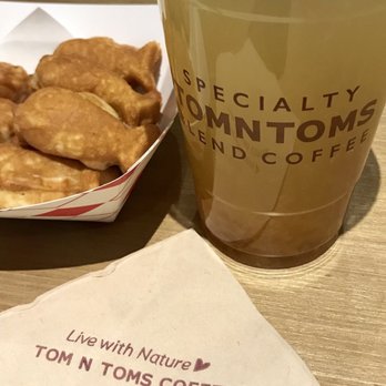 Tom N Toms Coffee - Citron tea with red bean filled fish shaped pastries - Coffee & Tea Near Me - Carrollton, Texas