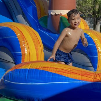 Cosmic Jumpers - My son enjoying the water slide - Bounce House Rentals Near Me - Antelope, California