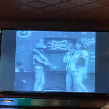 Logie’s On The Corner - two men playing video games - Sports Bars Near Me - Norman, Oklahoma Logie’s On The Corner - two men playing video games - Sports Bars Near Me - Norman, Oklahoma