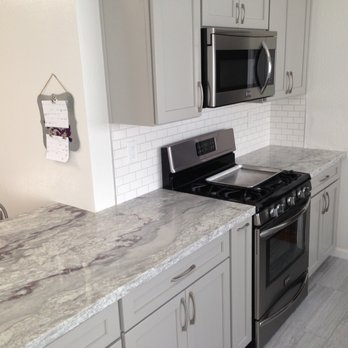 NG Construction - a kitchen with a stove and microwave - General Contractors Near Me NG Construction - a kitchen with a stove and microwave - General Contractors Near Me