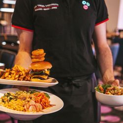 Les Trois Monkeys - Shrimp, Poke bowls, classic burgers, pizzas and more can be found at the Resto Bar inside Les Trois Monkeys.
