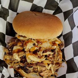 Chapman's BBQ - Pulled Pork sandwich with our own peach bbq sauce and french fried onions