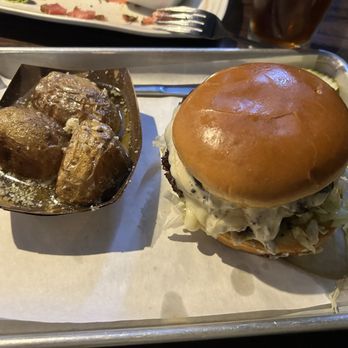Dukes On The Blvd - The Trip burger (mushroom/swiss) with the golden potatoes in garlic butter - New American Near Me - Jefferson City, Missouri Dukes On The Blvd - The Trip burger (mushroom/swiss) with the golden potatoes in garlic butter - New American Near Me - Jefferson City, Missouri