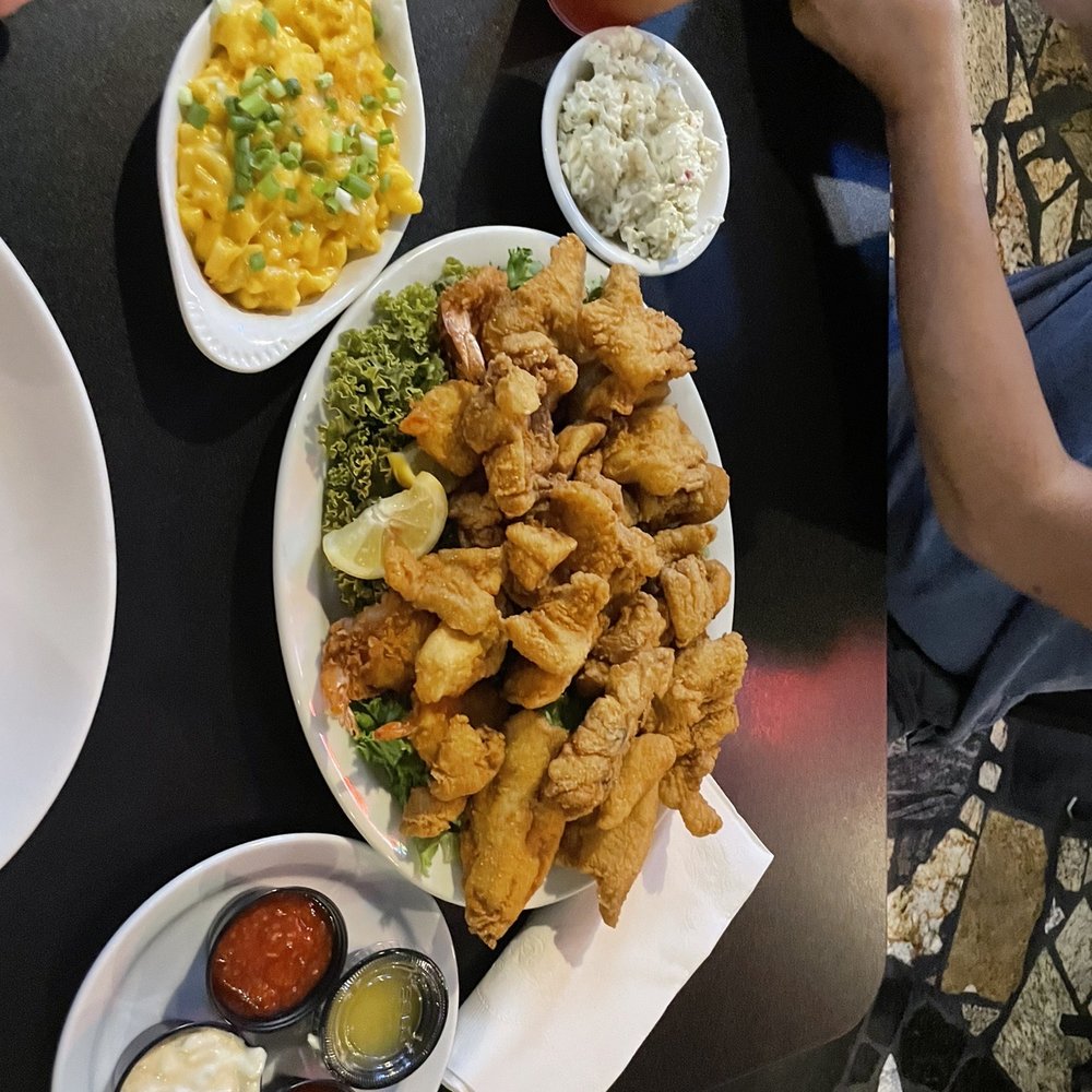 Seafood platter with coleslaw and Mac and cheese Seafood platter with coleslaw and Mac and cheese