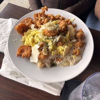 Orleans Bistro And Grill - This Bowl was so good! Base is fried potatoes, top with sausage gravy, eggs, shrimp, alligator bites and crawfish. - Southern Near Me - Fredericksburg, Virginia Orleans Bistro And Grill - This Bowl was so good! Base is fried potatoes, top with sausage gravy, eggs, shrimp, alligator bites and crawfish. - Southern Near Me - Fredericksburg, Virginia