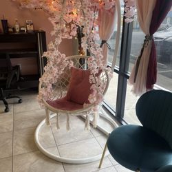 Asky Nails Spa - A lovely cozy chair with the flowers around it in the waiting area made me feel welcomed