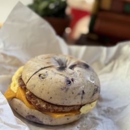 Breakfast blueberry bagel sandwich with sausage scramble and cheddar $7.95 Breakfast blueberry bagel sandwich with sausage scramble and cheddar $7.95