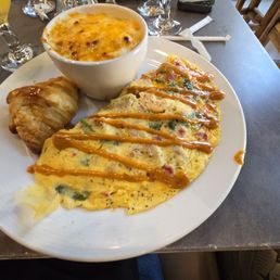 Cajun Shrimp Omelette w croissant and cheese grits Cajun Shrimp Omelette w croissant and cheese grits