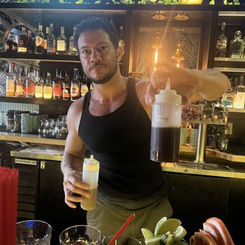 The CanTiki - Helpful bartender-he's showing off that their mixers are freshly made! - Tiki Bars Near Me - North Hollywood, California The CanTiki - Helpful bartender-he's showing off that their mixers are freshly made! - Tiki Bars Near Me - North Hollywood, California