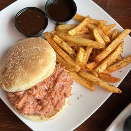 Jackfruit bbq sandwich with Cajun fries , bbq sauce and chicago sauce