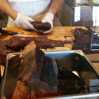 Killen's Barbecue - Brontasauras sized ones in pan (and yes, Brontasauras did exist) Guy in back deboning my ribs. - Barbeque Near Me - Pearland, Texas Killen's Barbecue - Brontasauras sized ones in pan (and yes, Brontasauras did exist) Guy in back deboning my ribs. - Barbeque Near Me - Pearland, Texas