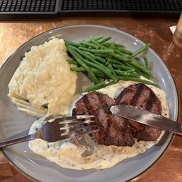 Steak dinner with garlic mashed and a creamy sauce to accompany the steak made with roaxford cheese delicious!!