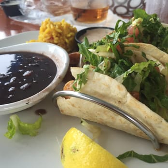 Dockside Waterfront Grill - Blackened grouper tacos with black beans and rice. Had already taken a bite - couldn't resist! - Seafood Near Me - Venice, Florida Dockside Waterfront Grill - Blackened grouper tacos with black beans and rice. Had already taken a bite - couldn't resist! - Seafood Near Me - Venice, Florida