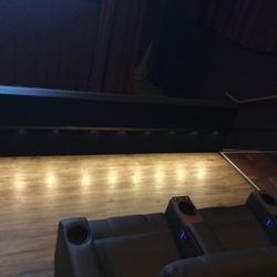 Malco Hollywood 12 Cinema - Seating area : Large walk space & walls between each row of seats.