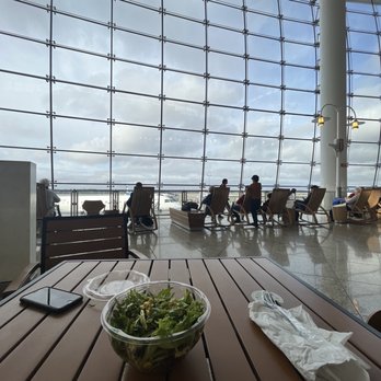 Evergreens - a bowl of salad on a table in front of a large window - Salad Near Me - Seattle, Washington Evergreens - a bowl of salad on a table in front of a large window - Salad Near Me - Seattle, Washington