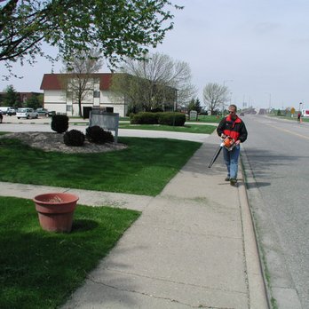 Mow-N-Man Services - ows mow - n - man on sidewalk - Landscaping Near Me - Washington, Illinois Mow-N-Man Services - ows mow - n - man on sidewalk - Landscaping Near Me - Washington, Illinois
