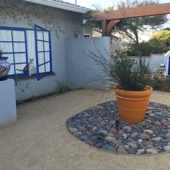 Hattas Studios - Barbara C. garden mural showing orange pot and landscaping - Painters Near Me - Los Angeles, California