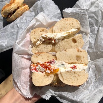 Absolute Bagels - Onion bagel with sundried tomato spread - Bakeries Near Me - New York, New York