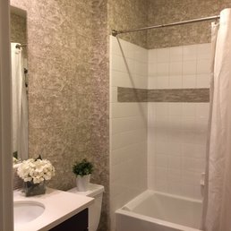 Bathroom freshly wallpapered by Paul