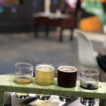 Hi-Wire Brewing - a flight of beers on a table - Breweries Near Me - Wilmington, North Carolina