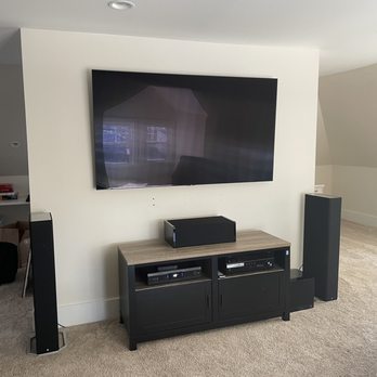 Tech2Call - Media room with 75" TV mounted, full surround hooked up, wires hidden under carpet - Home Theatre Installation Near Me - Saint Louis, Missouri