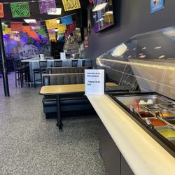 Coronas Taco's - Salsa bar with full service bar in the back. Large tvs all around