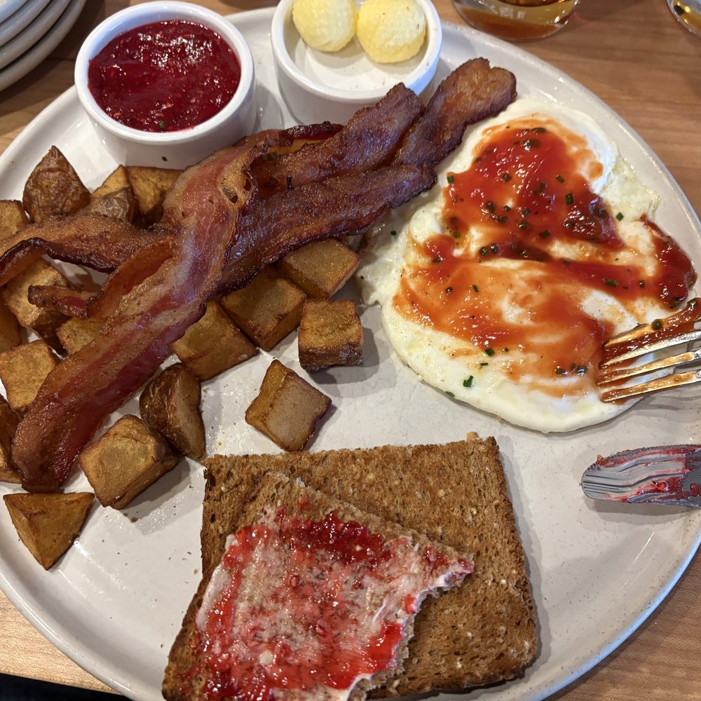 Breakfast plast with eggs over easy Breakfast plast with eggs over easy