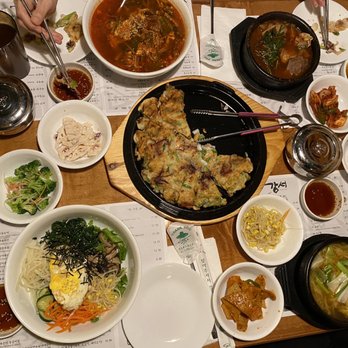 Kang Seo - a table full of asian food - Korean Near Me - Suwanee, Georgia Kang Seo - a table full of asian food - Korean Near Me - Suwanee, Georgia