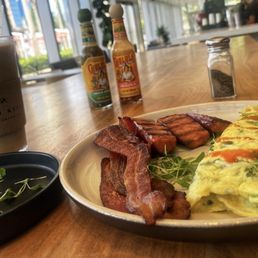 Fresh Herbed Omelette Breakfast w|parmesan cheese, bacon, sausage and avocado added Fresh Herbed Omelette Breakfast w|parmesan cheese, bacon, sausage and avocado added