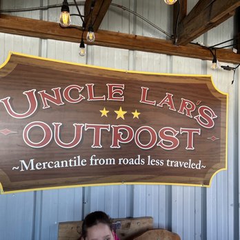 Uncle Lar’s Outpost - a woman sitting on a bench - Specialty Food Near Me - Trenton, Georgia Uncle Lar’s Outpost - a woman sitting on a bench - Specialty Food Near Me - Trenton, Georgia