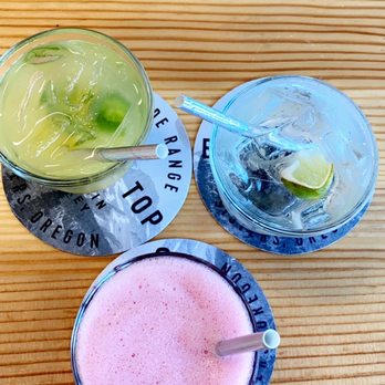 Wild Roots - Frozen lemonade w/huckleberry (pink), G&T w/the cucumber & grapefruit gin and pineapple jalapeño (yellow). All amazing! - Distilleries Near Me - Portland, Oregon Wild Roots - Frozen lemonade w/huckleberry (pink), G&T w/the cucumber & grapefruit gin and pineapple jalapeño (yellow). All amazing! - Distilleries Near Me - Portland, Oregon