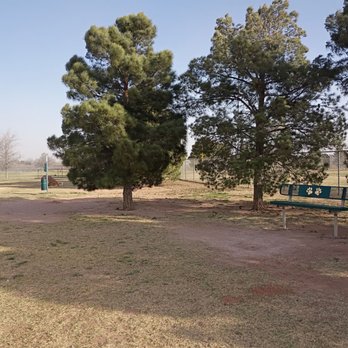 Waggin’ Trail Beal Dog Park - Some of the benches and the poop bag dispenser back there on the left - Dog Parks Near Me - Midland, Texas Waggin’ Trail Beal Dog Park - Some of the benches and the poop bag dispenser back there on the left - Dog Parks Near Me - Midland, Texas