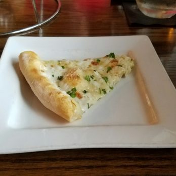 The Foundry - A slice of four cheese pizza. - Lounges Near Me - Pompano Beach, Florida The Foundry - A slice of four cheese pizza. - Lounges Near Me - Pompano Beach, Florida