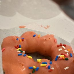 a glazed donut with sprinkles a glazed donut with sprinkles