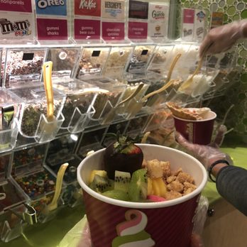 Menchie's Frozen Yogurt - a man holding a cup of yogurt - Ice Cream & Frozen Yogurt Near Me - Arvada, Colorado Menchie's Frozen Yogurt - a man holding a cup of yogurt - Ice Cream & Frozen Yogurt Near Me - Arvada, Colorado