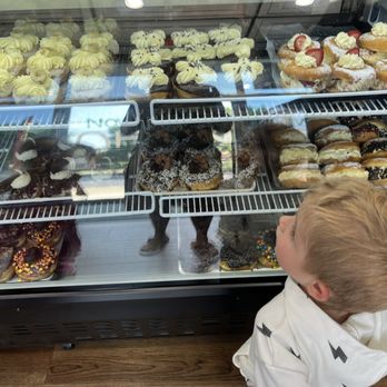 The Donut Factory - Deciding what to get from the case of donuts - Donuts Near Me - Dartmouth, Massachusetts