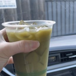 Sparkling water mixed with matcha powder Sparkling water mixed with matcha powder
