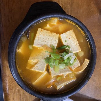Korean Garden - tofu soup in a black bowl - Korean Near Me - Tulsa, Oklahoma Korean Garden - tofu soup in a black bowl - Korean Near Me - Tulsa, Oklahoma